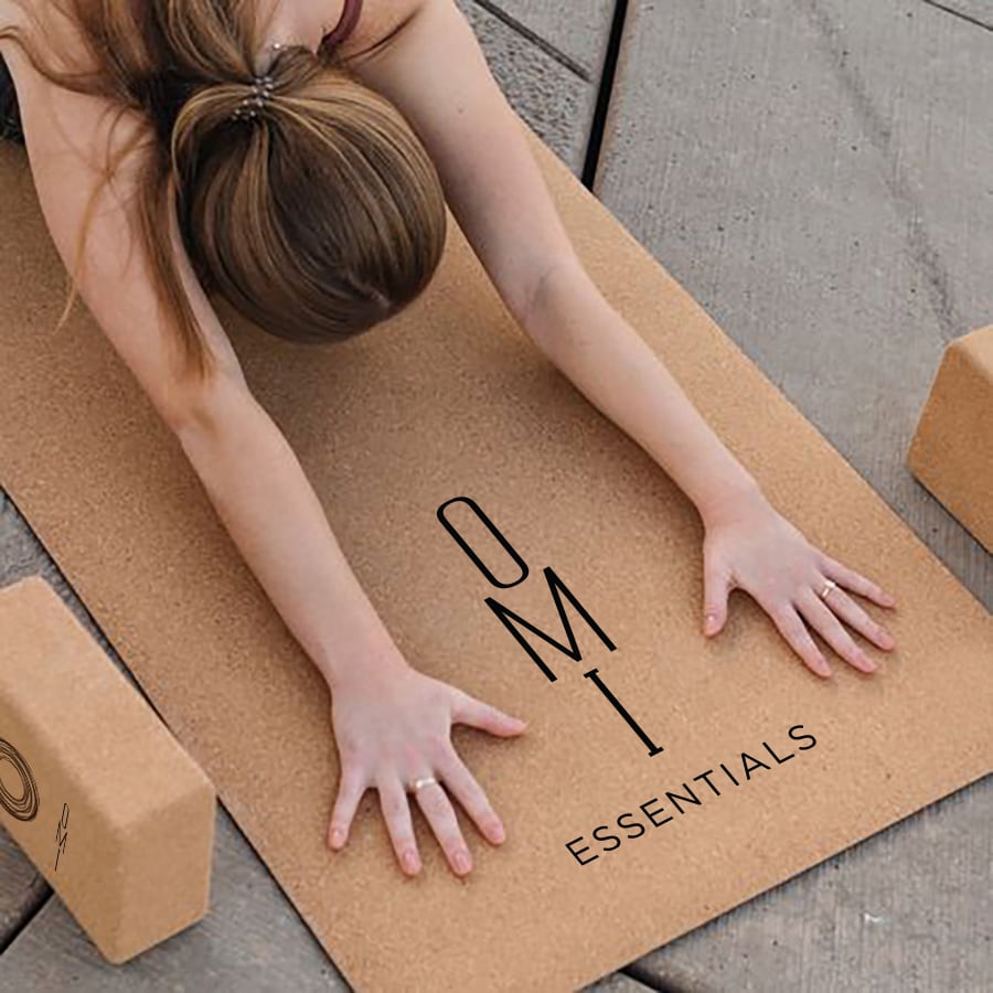 woman stretching on OMI Essentials cork yoga mat